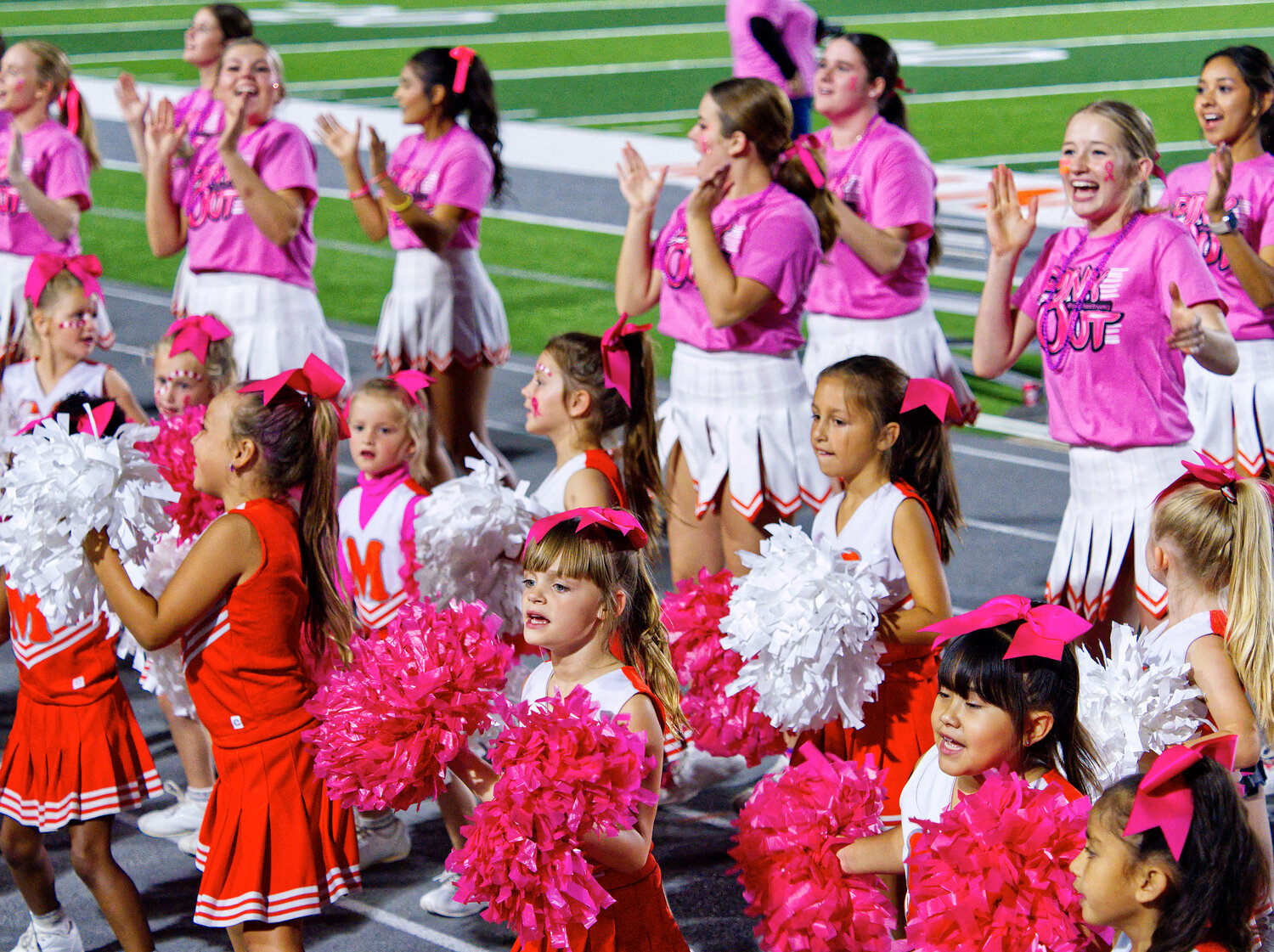 Some younger Yellowjacket cheerleaders got to join the varsity squad at Friday's game against Winnsboro. [find further football photos]
